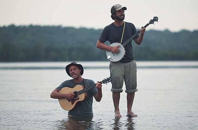 In this June 2011 photo provided courtesy of Alex Johnson, the Okee Dokee Brothers, Joe Mailander, left, and Justin Lansing are shown on the Mississippi River. The Minneapolis duo has been nominated for a Grammy Award for best children's album. 