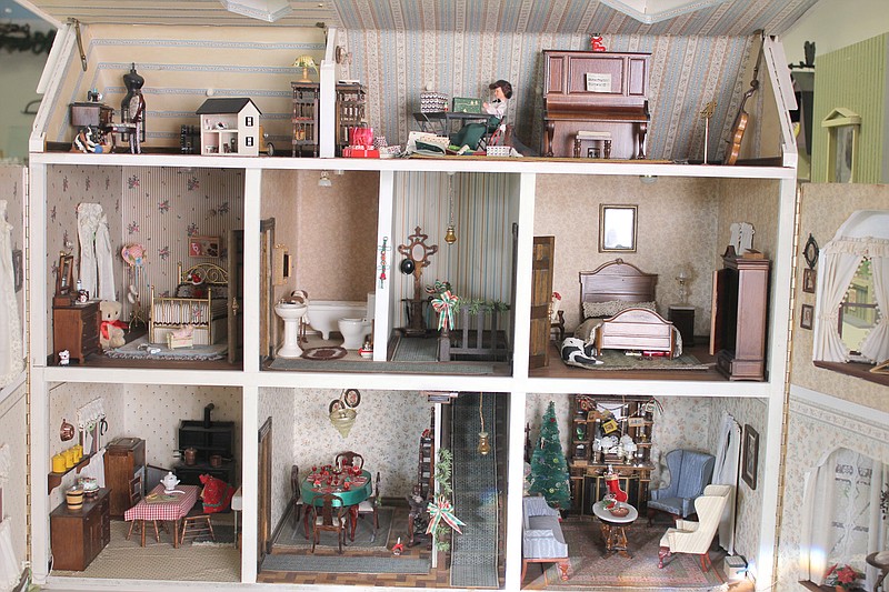 Miniature dollhouses are all about the details - the wallpaper, the trim, the bedding and all of the tiny accessories. 