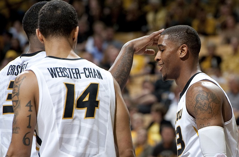 Earnest Ross (right) has his head tapped by Missouri teammate Tony Criswell as Negus Webster-Chan looks on during a game earlier this month against Appalachian State at Mizzou Arena.