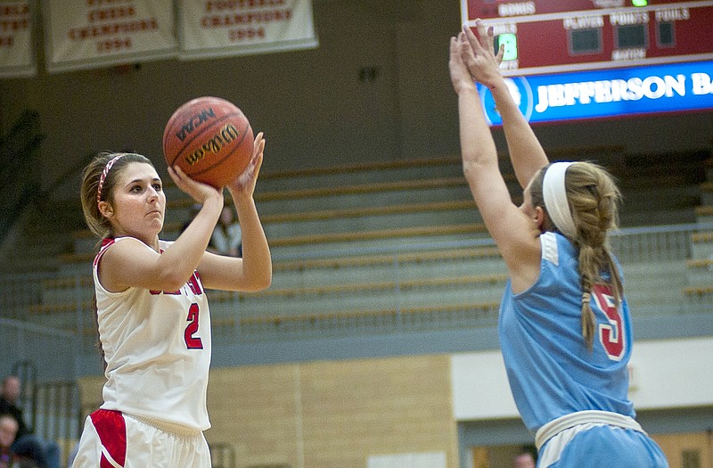 Jefferson City's Devon Stegeman puts up a 3-pointer over Glendale's Morgan Zimmerman during Tuesday's game at Fleming Fieldhouse.