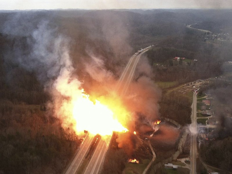 This image provided by the West Virginia State Police shows a fireball erupting across Interstate 77 from a gas line explosion in Sissonville, W. Va., Tuesday. At least five homes went up in flames Tuesday afternoon and a badly damaged section of Interstate 77 was shut down in both directions near Sissonville after the natural gas explosion triggered an hour-long inferno that officials say spanned about a quarter-mile.