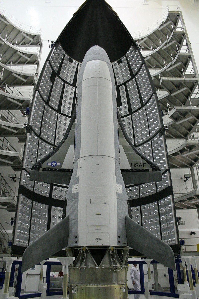 The X-37B Orbital Test Vehicle, above, is shown at the Astrotech facility in Titusville, Fla. Half of the Atlas V five-meter fairing is in the background. On Tuesday, the Air Force launched the top-secret, unmanned mini-space shuttle from Cape Canaveral, Fla.