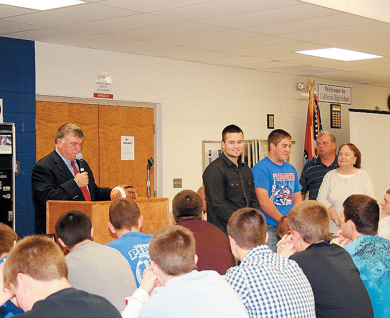 California High School Athletic Director Bob Staton, at left, presented the Randy Allee Scholarship to Curtis Fulks, center, and Ryan Korte at the CHS Football Banquet Sunday afternoon at the high school commons. At right are Paul and Susie Allee, who in the past have given the scholarship to one athlete each year, however, when they learned there were two deserving athletes, the Allees decided to give two scholarships, each for the full amount. 