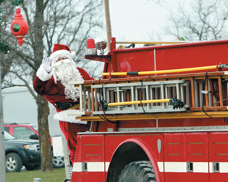 The annual Prairie Home Christmas Parade Saturday afternoon featured Santa taking a break from his sleigh to ride on a Prairie Home firetruck.  See page 13 for full coverage of the event.