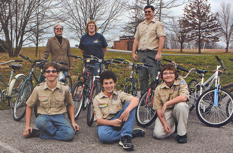 (Front row, from left) Lawrence Loftus, Grant Hendriscks and Andy Lidner with Boy Scout Troop 5o, along with (back row, from left) Kathy Becker of Girls Town, Tammy Wyman of Wal-Mart and Troop 50 Leader Tim Loftus present refurbished bicycles to Missouri Girls Town. Troop 50 has spent the past several months repairing broken bicycles from Wal-Mart and donating them to area groups and individuals.
