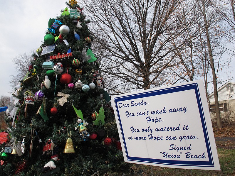 A man helping neighbors gut their storm-wrecked homes found an artificial Christmas tree in the gutter with other storm debris a few days after Superstorm Sandy pummeled the Jersey shore. He then watched in amazement as Union Beach made the tree its own, decorating it with hand-made ornaments, hand-scrawled messages of hope, lights and toys.