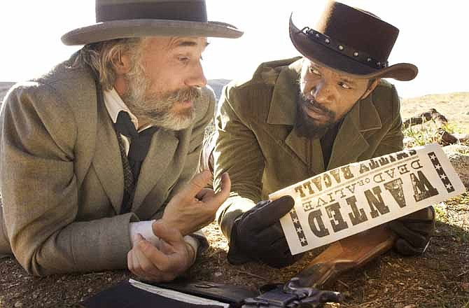 This undated publicity image released by The Weinstein Company shows, from left, Christoph Waltz as Schultz and Jamie Foxx as Django in "Django Unchained," directed by Quentin Tarantino. In Los Angeles, the Weinstein Co. canceled Tuesday, Dec. 18, 2012, planned premiere of the violent movie "Django Unchained." (AP Photo/The Weinstein Company, Andrew Cooper, SMPSP, File)