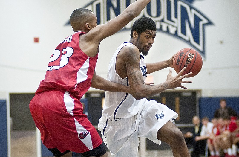 Lincoln's Charles Cole takes the ball to the basket during the Blue Tigers' 75-72 loss to Maryville on Wednesday night at Jason Gym.