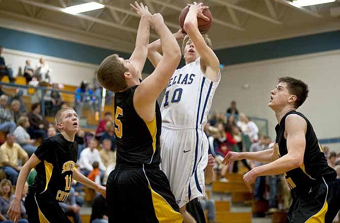 Helias' Collin Caywood takes a shot against Sedalia Smith-Cotton during Tuesday's game at Racker's Fieldhouse.