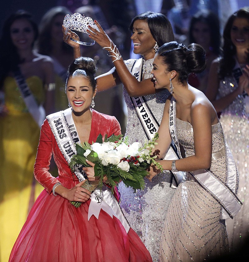 Miss USA, Olivia Culpo, left, is crowned Miss Universe during the Miss Universe competition, Wednesday in Las Vegas.