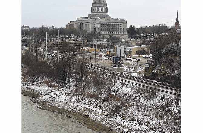 The exposed banks of the Missouri River lie covered with a dusting of snow on Thursday afternoon in Jefferson City. 