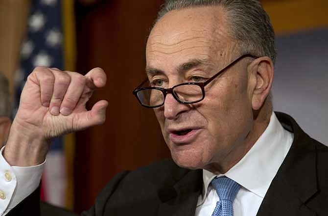Sen. Charles Schumer, D-NY, gestures to show how close he says the Speaker and the President are to a deal on the fiscal cliff, during a news conference at the U.S. Capitol in Washington, on Thursday, Dec. 20, 2012.
