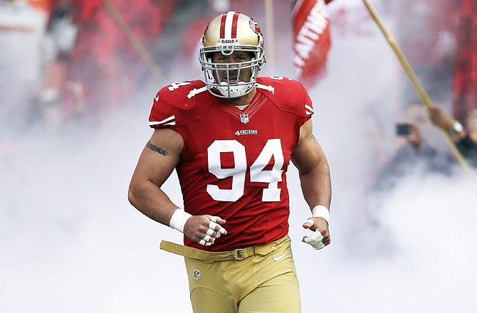 Justin Smith runs onto the field prior to a game this season in San Francisco.