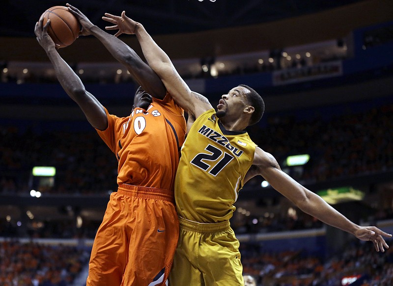 Illinois' Sam McLaurin, left, tries to get off a shot as Missouri's Laurence Bowers defends during the first half of an NCAA college basketball game Saturday, Dec. 22, 2012, in St. Louis.