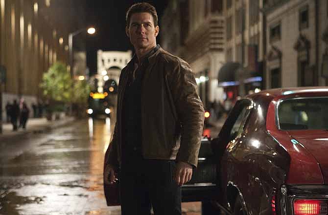 This publicity film image released by Paramount Pictures shows Tom Cruise in a scene from "Jack Reacher." Cruise plays a former military cop investigating a sniper case. Just turned 50, and just out with his latest action flick, "Jack Reacher," Cruise remains one of the biggest stars in Hollywood. 