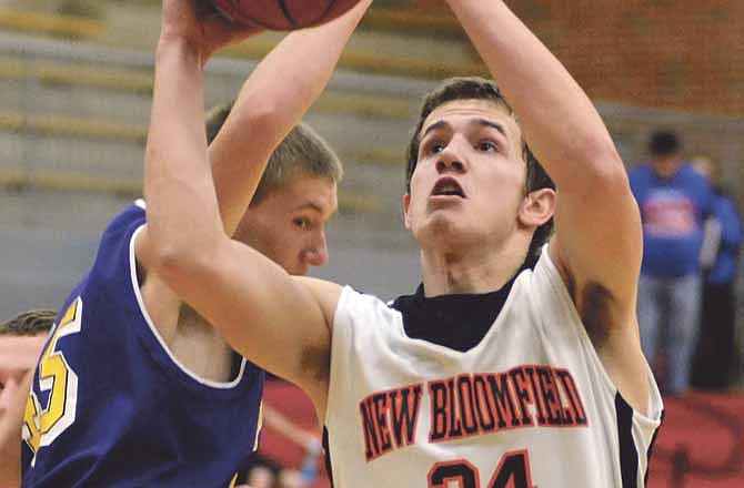 Justice Richards of New Bloomfield goes up for a shot as Jacob Keilholz of Chamois defends during Saturday's game in the Missouri National Guard Shootout at Fleming Fieldhouse.