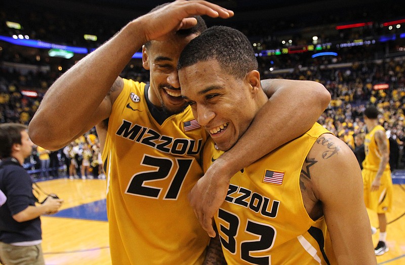 Missouri forward Laurence Bowers (21) celebrates with guard Jabari Brown after Saturday's 82-73 victory against Illinois in St. Louis.