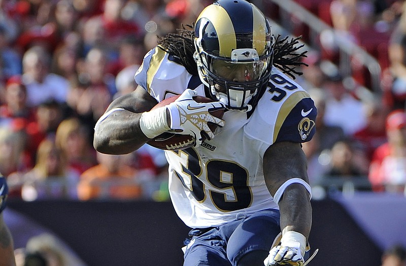 Rams running back Steven Jackson leaps away from a hit during the fourth quarter of Sunday's game in Tampa, Fla.