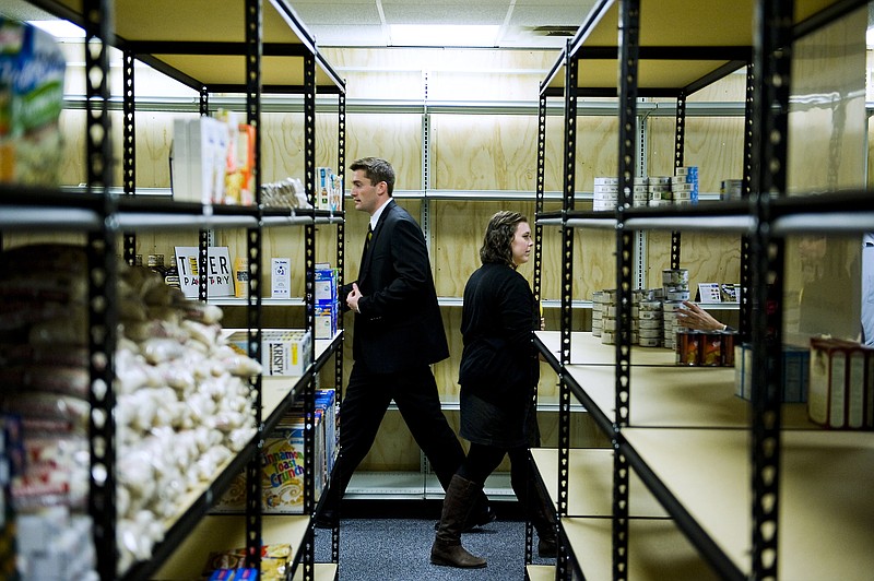 Nick Droege, left, founder of Tiger Pantry food pantry for students, and Amanda Gray, operations coordinator for Tiger Pantry, walk through the facility during an opening ceremony in Columbia. The food pantry is serving students in need of assistance in the Columbia area.