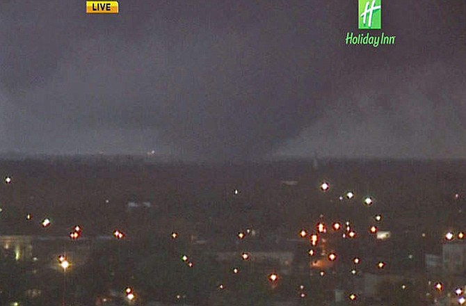 In this image from video provided by WALA-TV in Mobile, Ala. a tornado touches down in Mobile on Tuesday, Dec. 25, 2012. The tornado hit some areas of downtown Mobile Tuesday, causing severe damage in the area before moving north, officials said. 