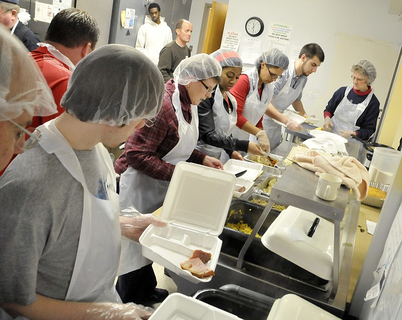 Several dozen Mid-Missouri residents, some from as far as Gravois Mills, volunteered a portion of their Christmas Day to serve dinner at the Salvation Army Center of Hope.