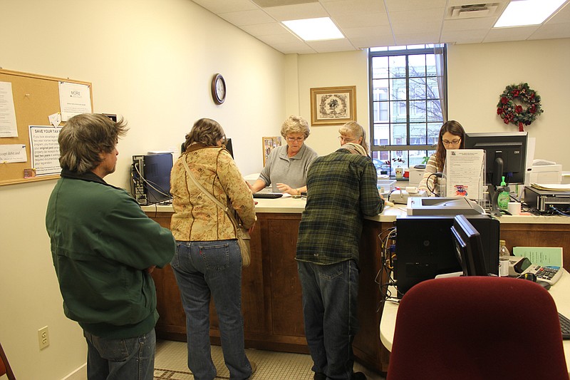Frances Vaughn in the Callaway County Collector's office helps taxpayers as they file their personal property taxes Thursday. Taxes are due by mail or in person to the office by Monday, Dec. 31.