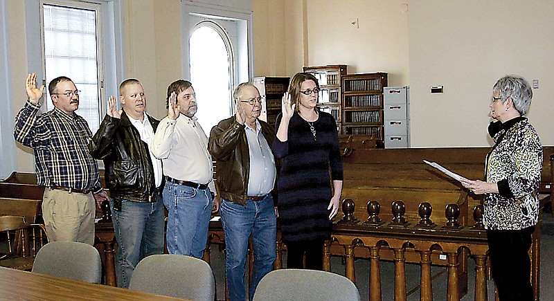 Being sworn in by Moniteau County Clerk Anita Groepper on Thursday, Dec. 27, are several county elected officials. They are, from left, First District Commissioner Tony Barry, Sheriff Jeptha Gump, Second District Commissioner Kim Roll, Coroner Loyd Fulks and Public Administrator Cher Caudel. 