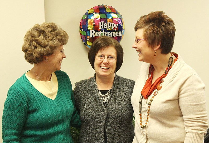 A total of 63 years of service to the Callaway County Treasurer's Office is represented by two women who congratulated Treasurer Marsha Chism, center, for her 34 years of service to the office, 28 of them as treasurer.  during her retirement reception Friday at the Courthouse. Serving as deputy treasurer for 21 years is Joyce Vandelicht, left, and Debbie Zerr, right, who has been deputy treasurer for the last eight years. In January, Zerr will take office as treasurer after her election to the office on Nov. 6.