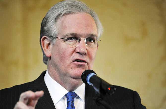 In this Feb. 9, 2012 file photo, Gov. Jay Nixon talks to members of the media during a question and answer session at the Governor's Mansion in Jefferson City, Mo.