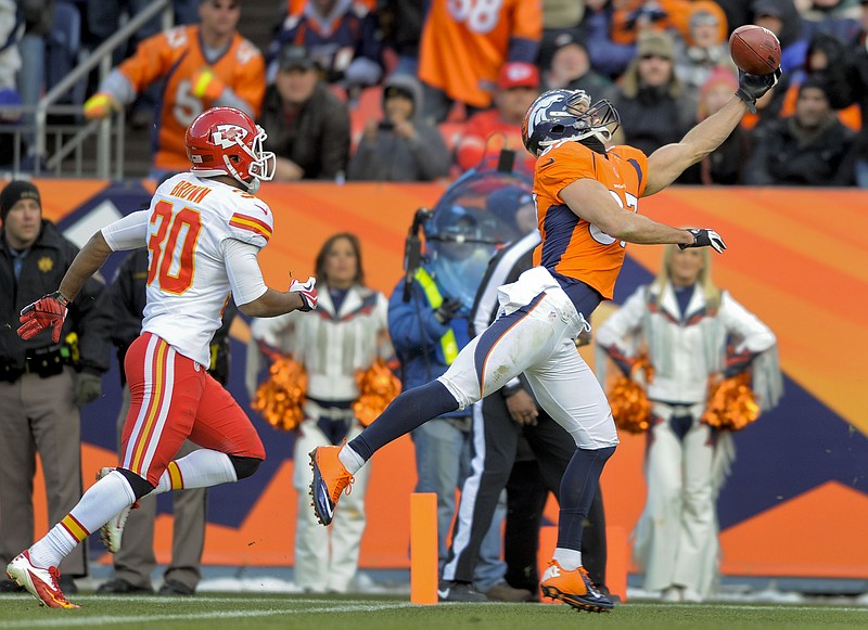 Denver Broncos wide receiver Eric Decker (87) makes a one-handed catch for a touchdown in front of Kansas City Chiefs defensive back Jalil Brown (30) in the second quarter of an NFL football game, Sunday, Dec. 30, 2012, in Denver.