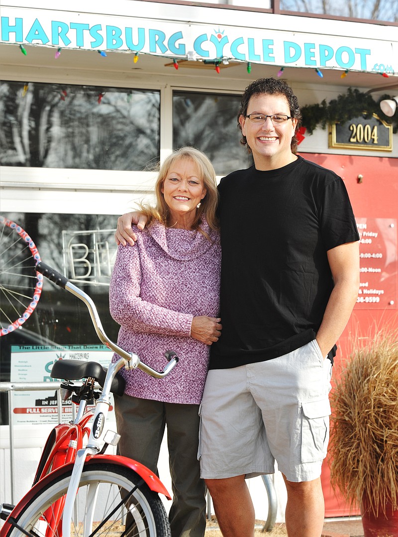 Mark and Pam Allchorn pose outside their Hartsburg Cycle Depot on West Main Street.