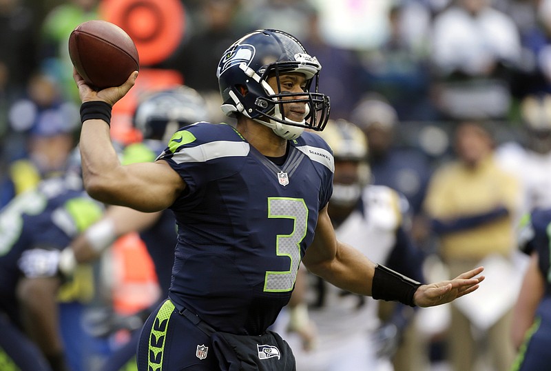 Seattle Seahawks quarterback Russell Wilson passes in the first half of an NFL football game against the St. Louis Rams, Sunday, Dec. 30, 2012, in Seattle. 