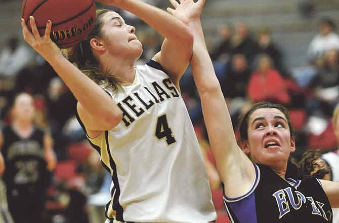 Taylor Hagenhoff of Helias battles Eureka's Mia Fiore for a rebound during Saturday's game at Fleming Fieldhouse.