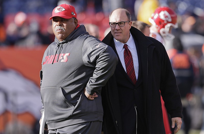 Romeo Crennel (left) and Scott Pioli watch as the Kansas City Chiefs warm up before Sunday's game against the Broncos in Denver. Crennel is no longer the Chiefs' coach, while Pioli, the general manager, will not be in charge of hiring Crennel's replacement.