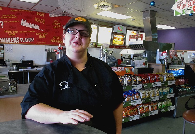 This Friday, Dec. 28,2012 photo Kaylee Feight talks about the impact of a minimum wage increase on her job at Quiznos in Helena, Mont. Montana's minimum wage workers are getting a small pay raise on New Year's Day when an automatic cost-of-living increase takes effect.