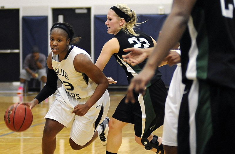 Lincoln guard Arriana Walker drives toward the basket in a game. She tops the team in three individual categories.