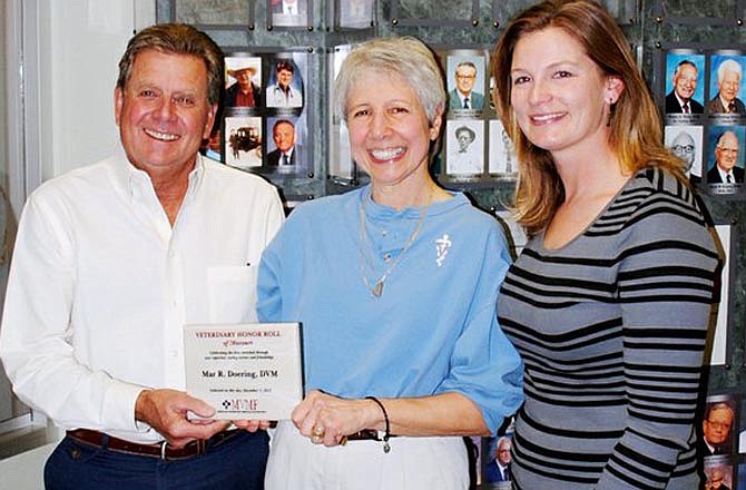 Dr. Mar Doering of Holts Summit, center, has been inducted to the Missouri Veterinary Foundation Veterinary Honor Roll. With her is foundation board member Dr. Roger Dozier of Jefferson City and Julie Braun, operations manager of the Missouri Veterinary Medical Foundation of Jefferson City. 