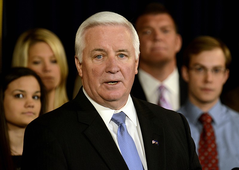 Pennsylvania Gov. Tom Corbett spoke at a news conference Wednesday, in State College, Pa. Corbett said the NCAA overstepped its authority in the wake of the Jerry Sandusky child molestation scandal. 