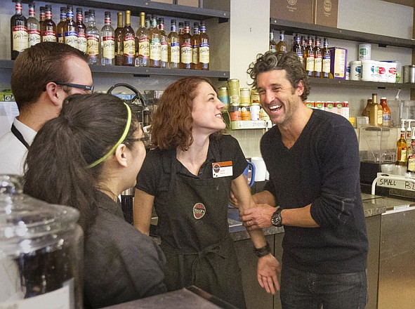 Patrick Dempsey meets the staff at the Tully's Coffee on Western Avenue near the Pike Place Market on Friday after his investment group won the bid to purchase the small chain. Dempsey mets employees Stephen Loewen, Susie Campos and Sarah Paulson. 