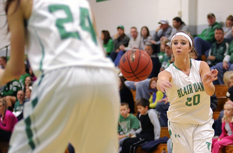 Blair Oaks' LeeAnn Polowy fires a pass to  the low post during Friday night's matchup against Warsaw in Wardsville.