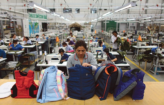 A worker inspects armored vests designed for children at the Miguel Caballero factory on the outskirts of Bogota, Colombia. Miguel Caballero, who has made armored vests for adults for more than 20 years, said he had never thought about making bulletproof goods for children. His new line of products are designed for children ranging in age from 8-16 years and are priced at anywhere from $150-$600 depending on the complexity of their construction. Each piece weighs between 2-4 pounds.