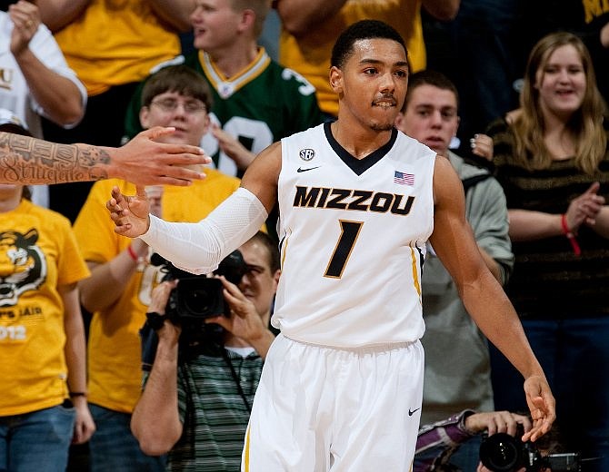 Missouri's Phil Pressey celebrates with teammates after he scored a three-pointer during the second half of an NCAA college basketball game against Bucknell Saturday, Jan. 5, 2013, in Columbia, Mo. Missouri won the game 66-64. 