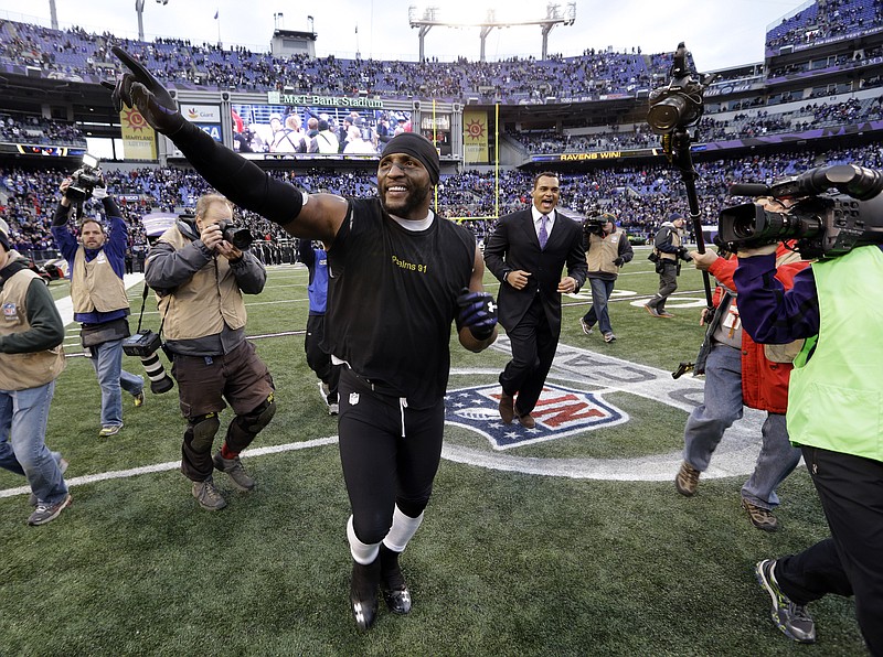 Baltimore Ravens inside linebacker Ray Lewis, center, celebrates with a victory lap around the field after an NFL wild card playoff football game Sunday, Jan. 6, 2013, in Baltimore. Lewis has said he will retire at the end of the season, and the Ravens won 24-9. 