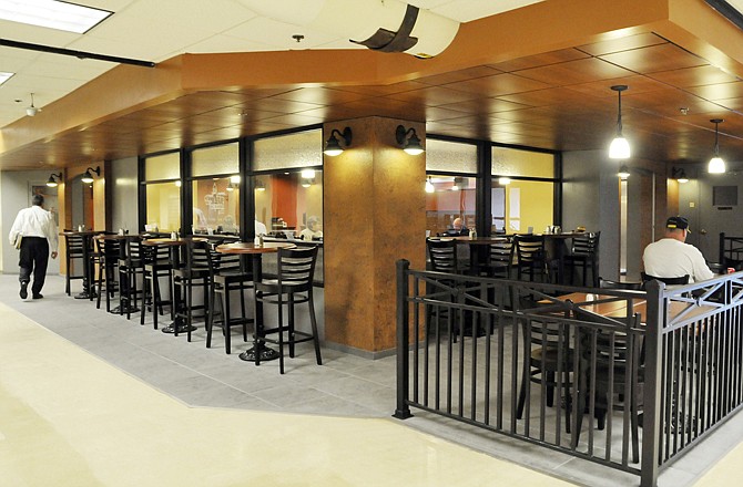 The remodeled cafeteria in the Missouri Capitol recently opened under the name Capitol Grill. The grill has a new look, new food, new atmosphere and a new chef. Below, sous chef Logan Brazzell fries a butter burger.