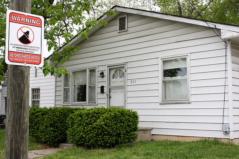 This file photo shows the former rented Sixth Steet home where John David Farnell of Fulton parked his white minivan during his bank robbing spree four years ago. At the time of his arrest in April of 2010, a Fulton Neighborhood Crime Watch sign was mounted on a pole in front of his residence.