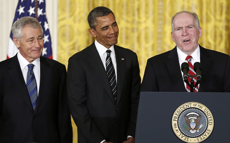 President Barack Obama and his choice for Defense Secretary, former Nebraska Sen. Chuck Hagel, left, listen Monday as the president's choice for CIA Director, Deputy National Security Adviser for Homeland Security and Counterterrorism, John Brennan, right, speaks in the East Room of the White House in Washington, Monday.