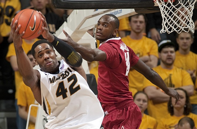 Missouri's Alex Oriakhi pulls a rebound away from Alabama's Devonta Pollard during the first half of Tuesday's game in Columbia.