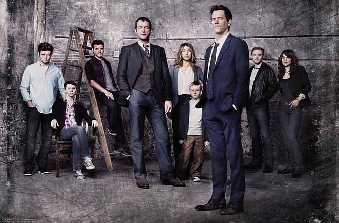 This undated publicity photo released by FOX shows Kevin Bacon, front right, as former FBI agent Ryan Hardy, who is called out of retirement to track down James Purefoy, (fourth from left) as Joe Carroll, in the new psychological thriller "The Following," premiering Monday, Jan. 21, 2013, on FOX. From rear left, cast members, Nico Tortorella, Valorie Curry, Adan Canto, Natalie Zea, Kyle Catlett, Shawn Ashmore and Annie Parisse.
