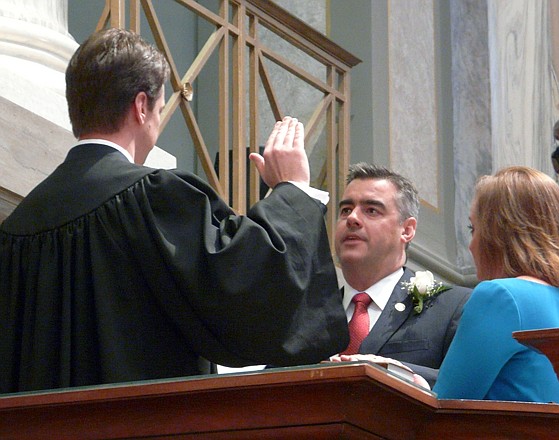 While wife Molly holds the Bible, state Sen. Tom Dempsey, R-St. Charles, is sworn in Wednesday as the Missouri Senate's new president pro tem by former Sen. Jack Goodman, R-Mount Vernon, a new circuit judge in southwest Missouri.