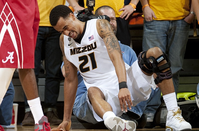 Laurence Bowers of Missouri struggles to get up off the court after injuring his knee in the second half of Tuesday night's game against Alabama at Mizzou Arena. Bowers suffered a sprained MCL in his right knee in the game and will miss at least the next two games.
